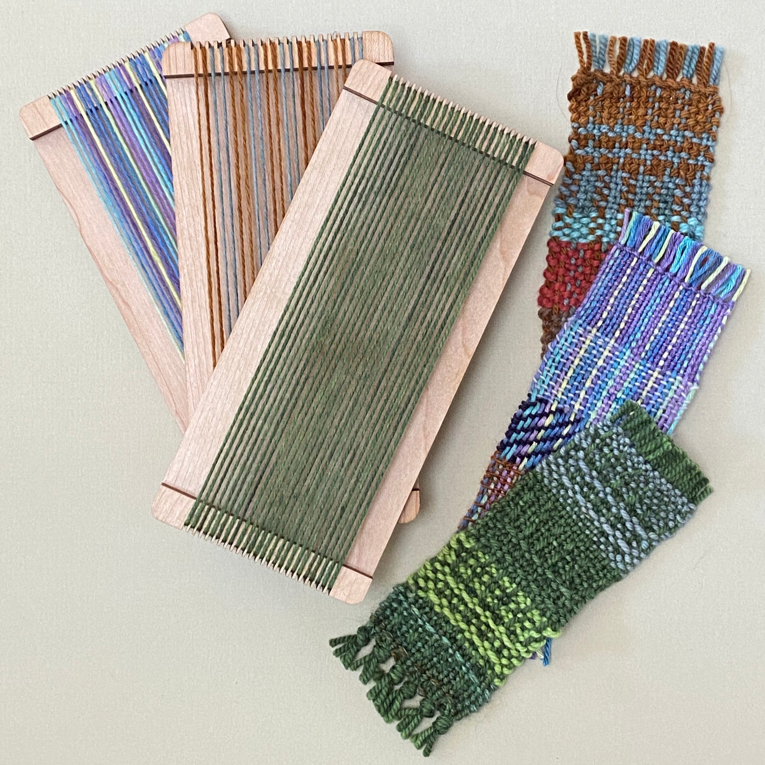 Size 8, 10, and 12 mini looms with different warps and three swatches made from those warps in various colors and structures.