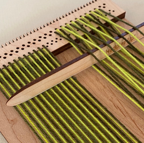 pick-up stick inserted into a warp